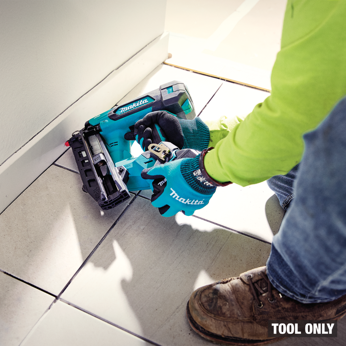 Makita XNB06Z 18V LXT Brush1less 16 Gauge Angled Finish Nailer in use baseboard