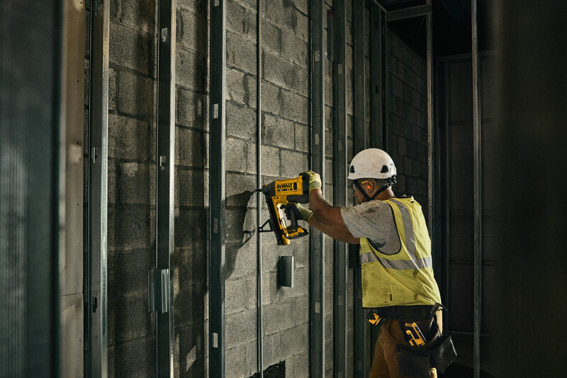 DeWalt 20V MAX Trak-It C6 Cordless Gas Concrete Nailer in use jobsite 2